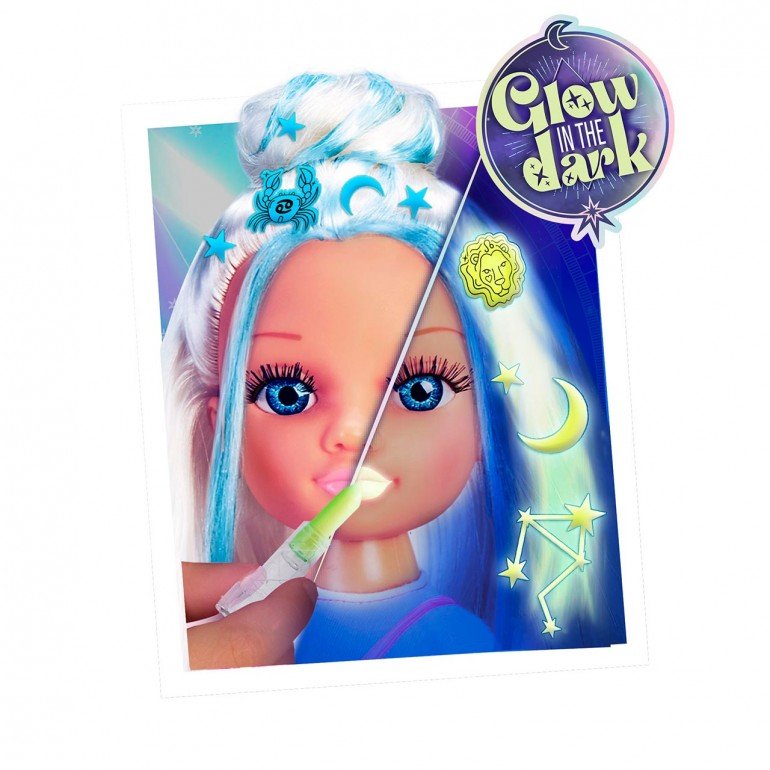 Doll close-up with long white hair streaked blue, wearing a pink dress
