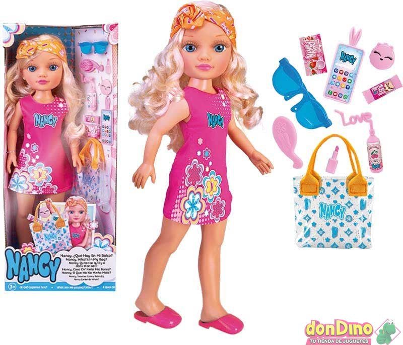 Fashion doll in pink dress with printed headband, plus blue patterned bag and accessories