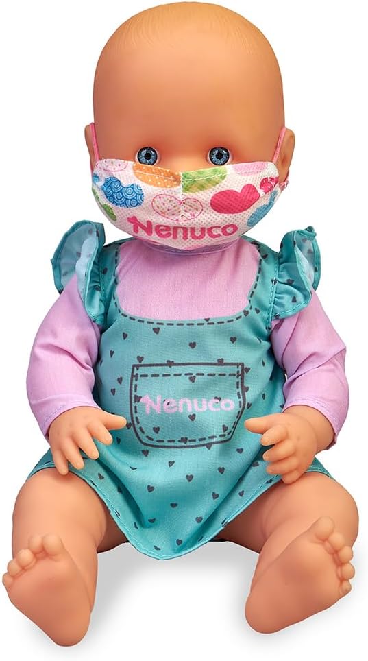 Baby doll wearing a heart-pattern face mask and a teal heart romper with pink sleeves