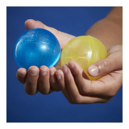 Hydro balls in hands: one blue and one yellow-green translucent ball