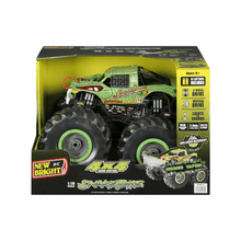 Monster truck RC toy in retail box with green and black hissing vapor design, 4x4.