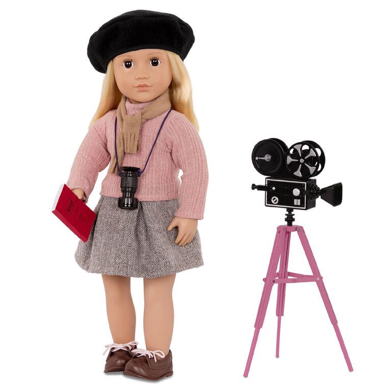 Movie director doll with black beret, pink top, gray skirt, holding clapperboard; includes camera.