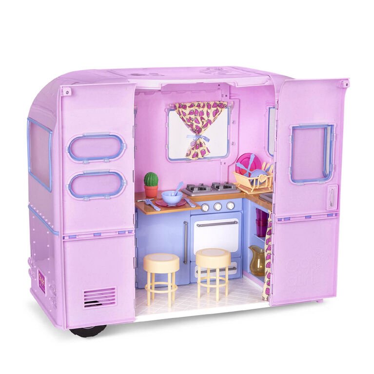 Playset camper trailer with open side, kitchen setup, table, and two stools