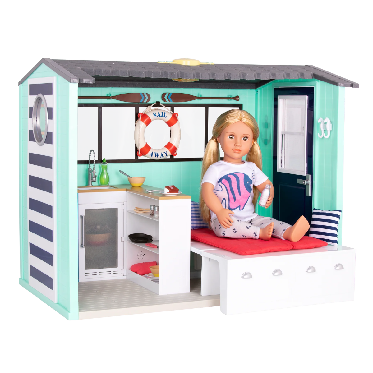 Seaside Beach House playset with doll on sofa bed and kitchen appliances