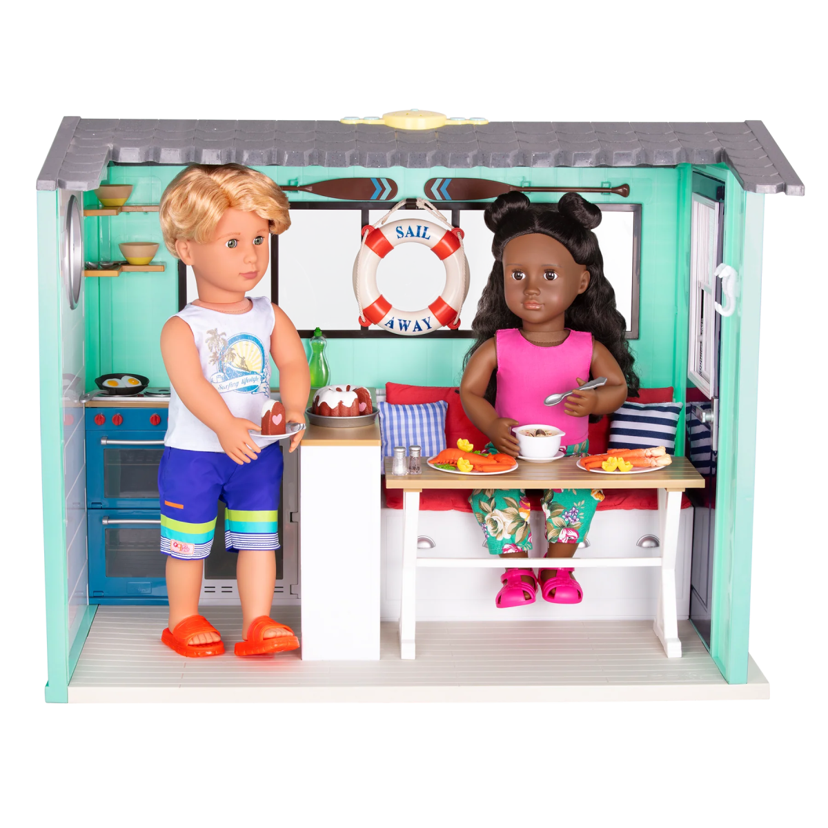 Seaside Beach House with two dolls at table, stove and lifebuoy behind