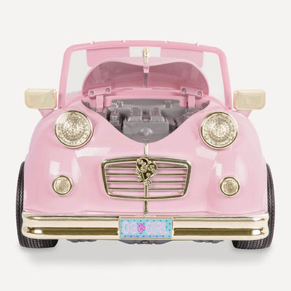 Pink retro convertible toy car front with open hood, headlights, chrome grille, and license plate.