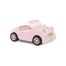 Pink retro convertible toy car with open top, chrome grille, and whitewall wheels.