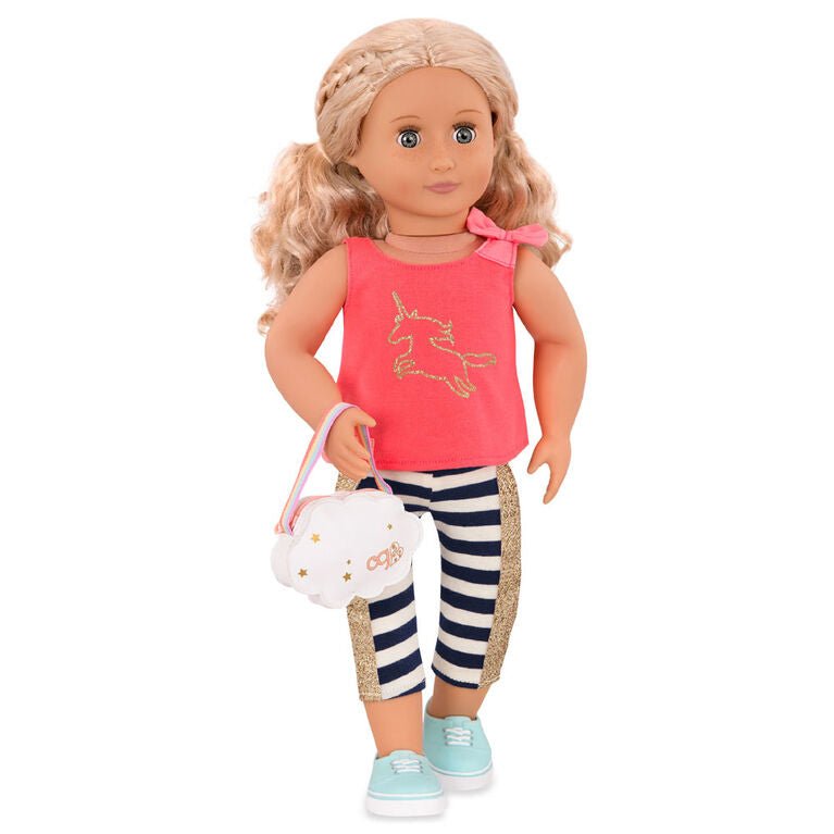 Doll in coral unicorn top and navy striped leggings with gold trim, teal shoes, holding cloud bag