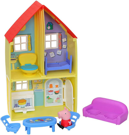 Dollhouse playset with open rooms, blue toilet, purple couch, and small table