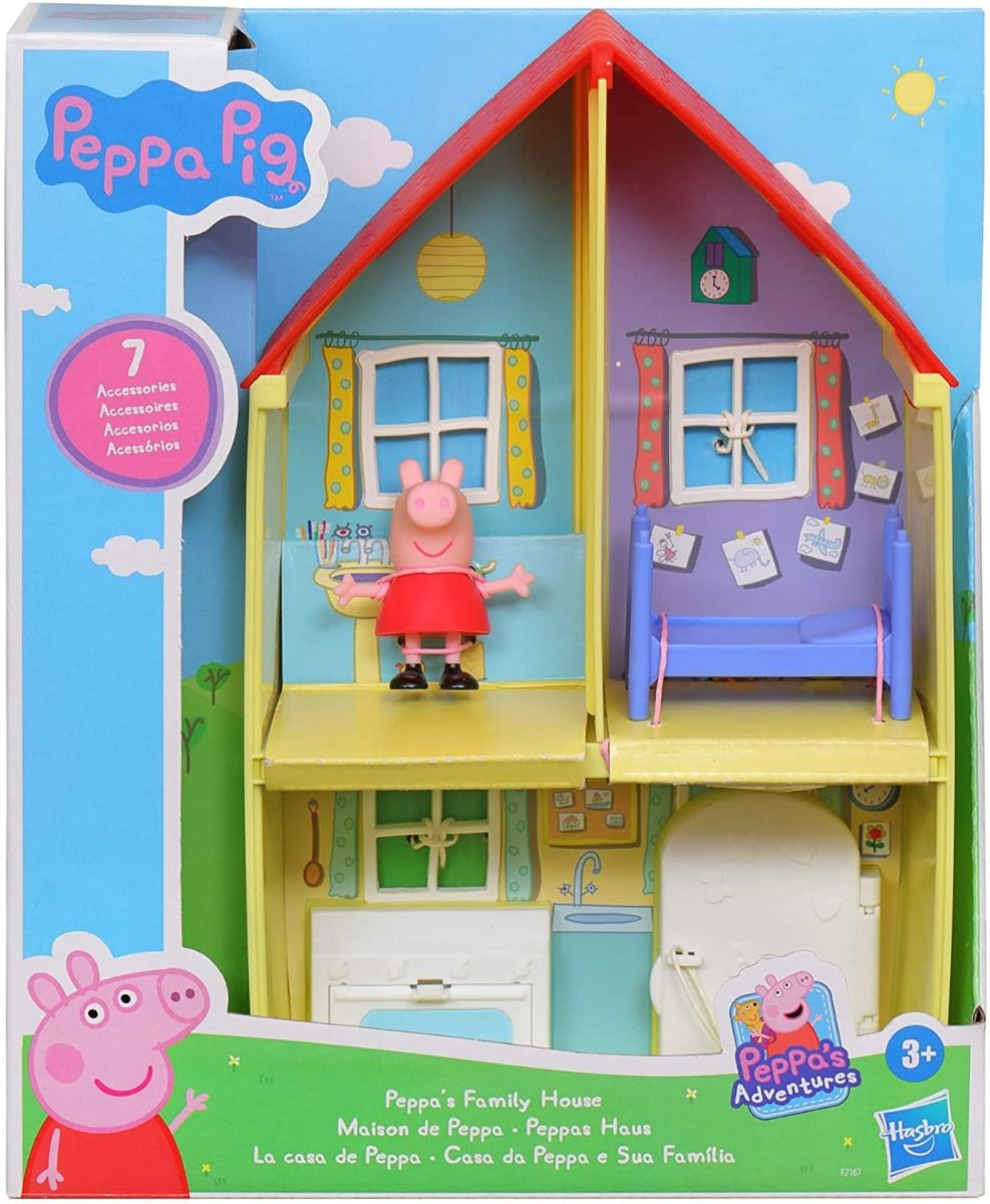Dollhouse playset with red roof, purple and green rooms, and Peppa figure