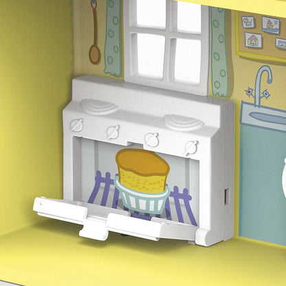 Toy stove window with yellow pot and blue-and-white striped oven surround
