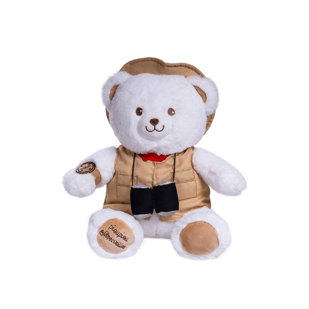 White bear plush sitting with tan vest, red scarf, and black pouch