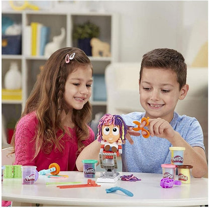 Play-Doh Crazy Cuts stylist set with character figure and teal sculpting tools on table