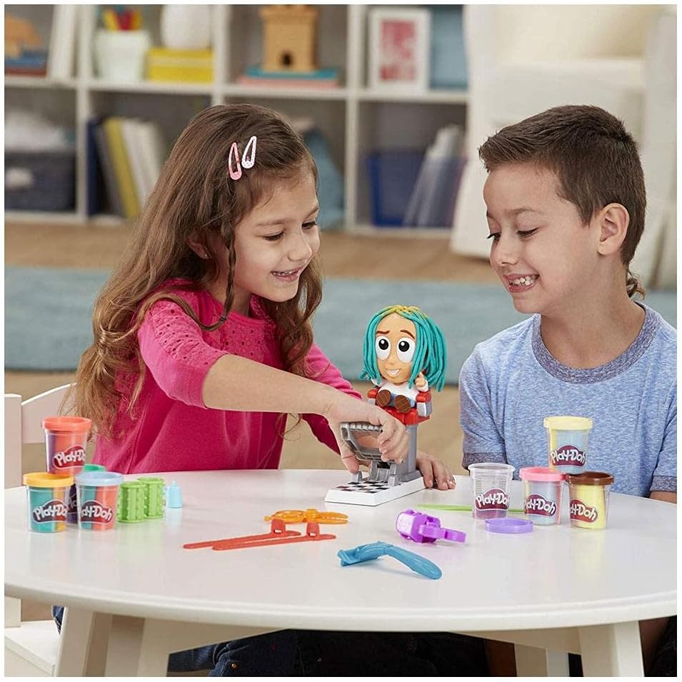 Play-Doh Crazy Cuts stylist set with character figure and sculpting tools at play table