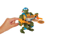 TMNT Leo figure holding pizza disc, blue eyes and orange vest