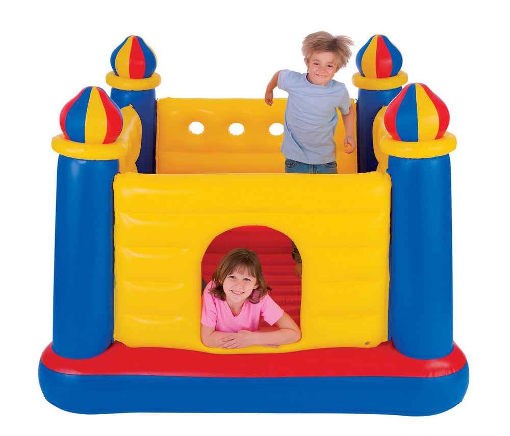 Inflatable castle bouncer with yellow front panel, blue side towers, red base and door opening