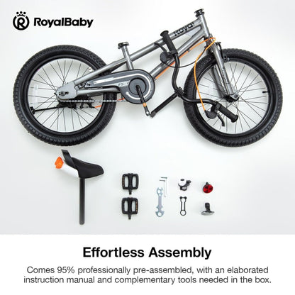 Grey kids bike with included assembly tools and parts, including pedals and wrench