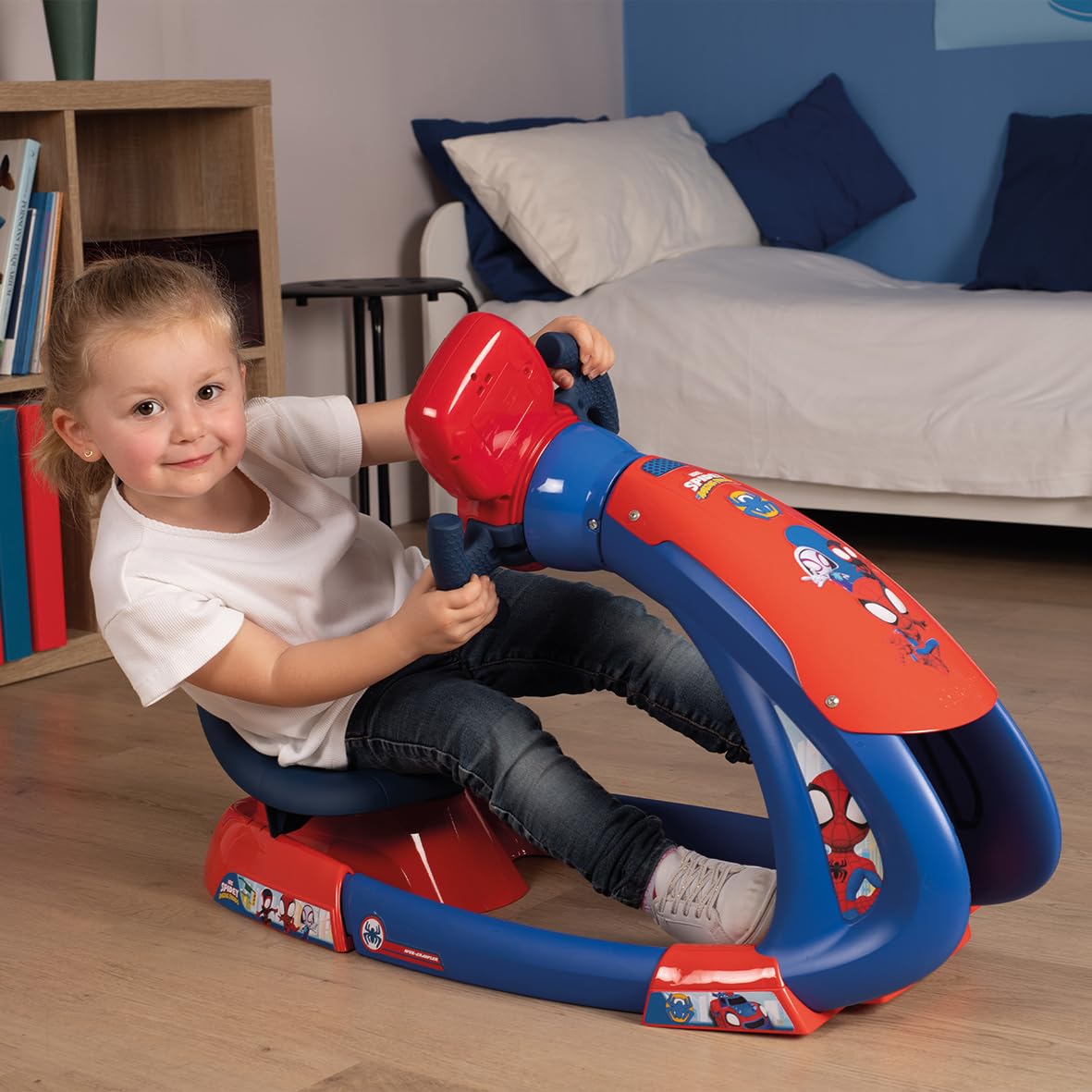 Spidey V8 Driver ride-on scooter with red headrest, blue frame and handlebar, child seated