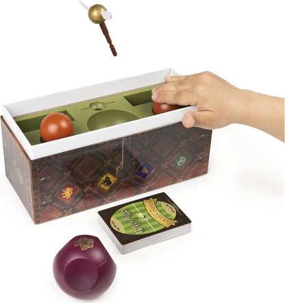 Harry Potter Catch the Golden Snitch game box with cards, green tray, and maroon pieces