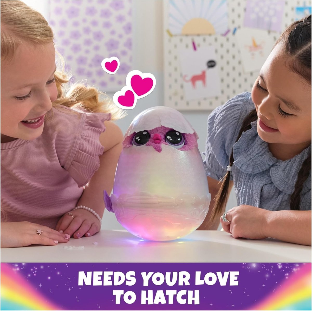 Purple and pink glowing hatching egg toy with baby creature, held by kids