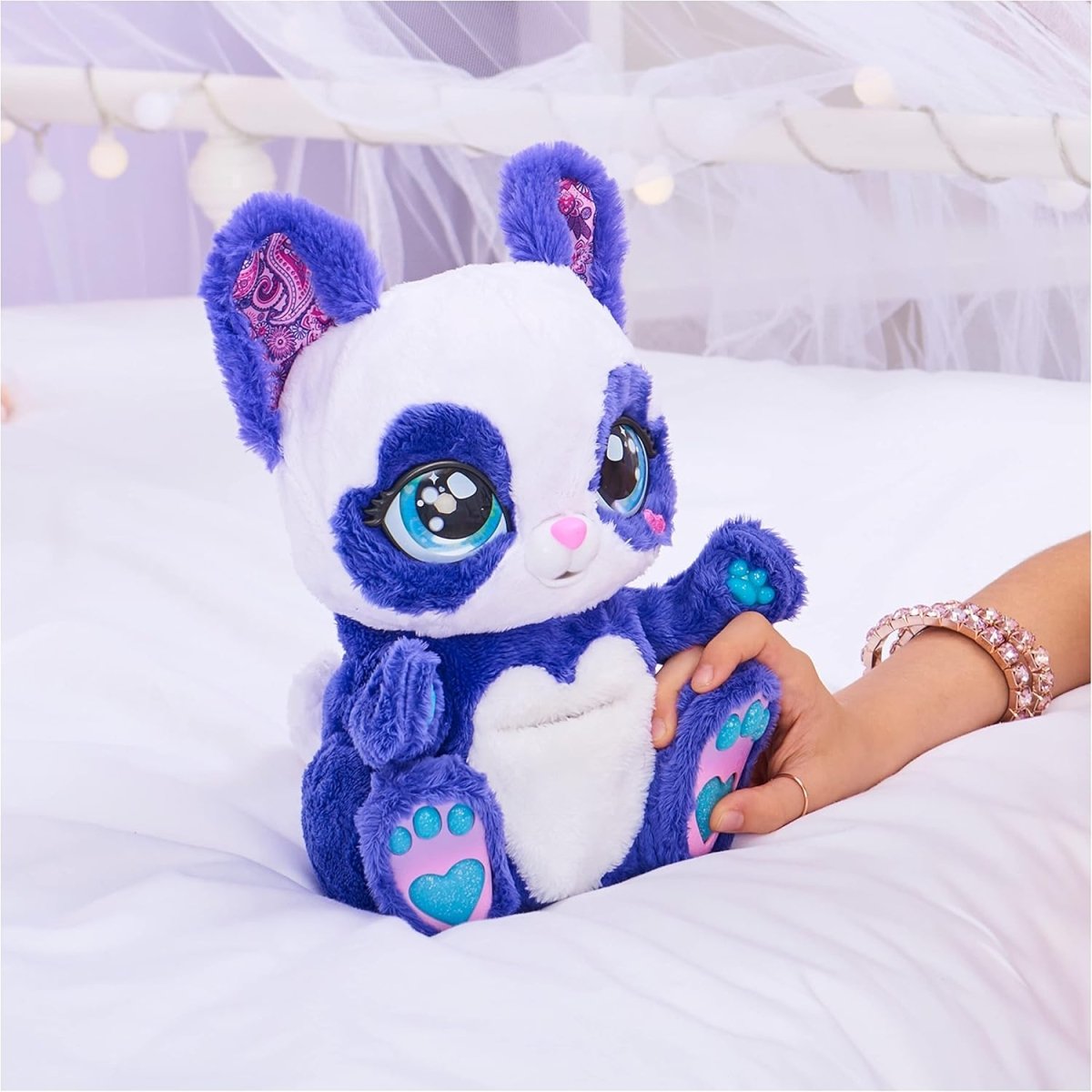 Purple and white panda-roo plush toy sitting, showing teal paw pads and blue eyes