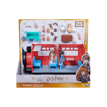Hogwarts Express toy train set in retail box, red train with blue interior and figures