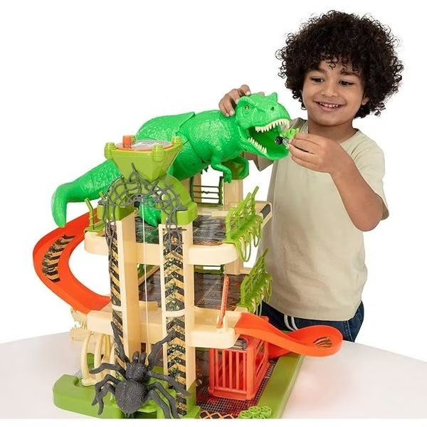 3-level dinosaur-themed car garage playset with green T-rex and orange tracks