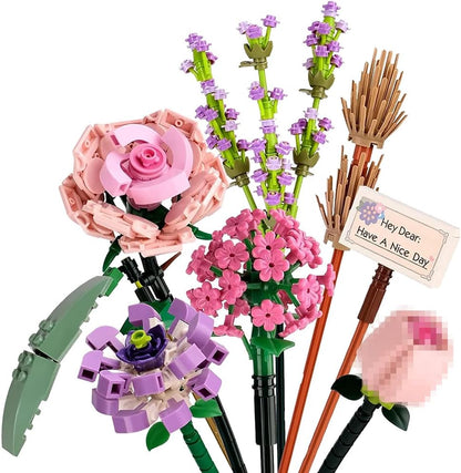 Close-up mini flower building bricks: pink rose base, purple blossoms, green stems