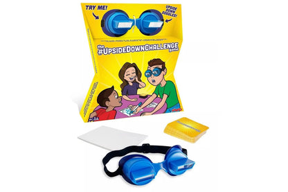 Upside-down challenge game set with yellow box, blue goggles headband, and cards
