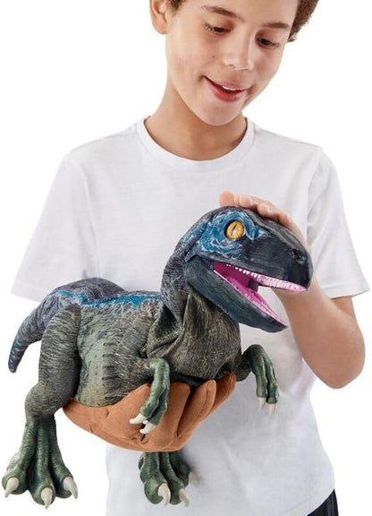 Child holding Blue Training Edition Puppetronic dinosaur puppet with open blue mouth