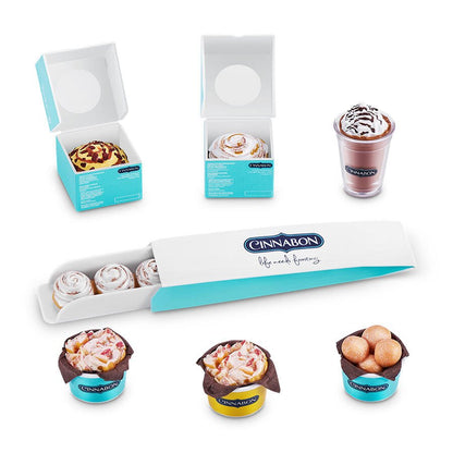 Mini Cinnabon themed collectibles: pastry boxes and frosting-topped cinnamon roll cups