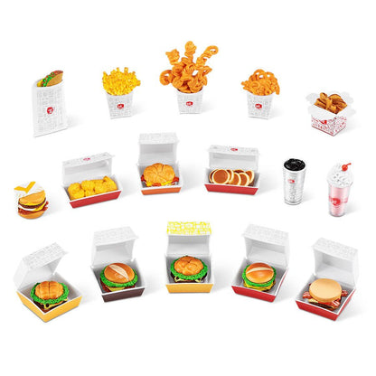 Assorted mini food collectible packages with red and orange snack items in open trays