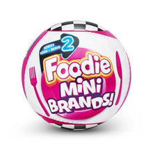 Pink and white mini collectible ball with Foodie Mini Brands graphics and checkered rim