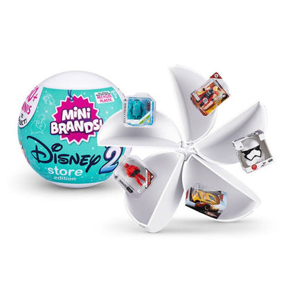 Mini Brands Store Series 2 capsule with teal Disney ball and opened white wheel