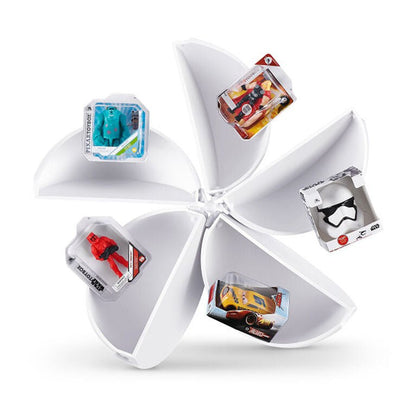 Open white Mini Brands capsule wheel with compartments holding mini boxed items
