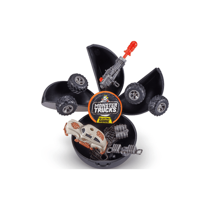 Black Monster Trucks surprise capsule with miniature trucks, red parts, and guide
